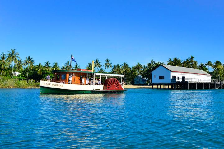 a boat is docked next to a body of water